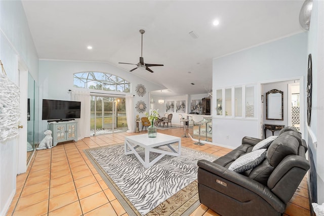 living room featuring crown molding, ceiling fan, light tile patterned floors, and vaulted ceiling