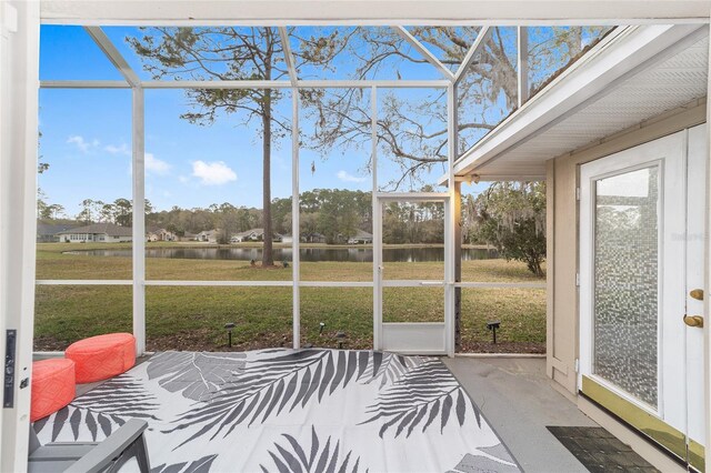 sunroom with a water view