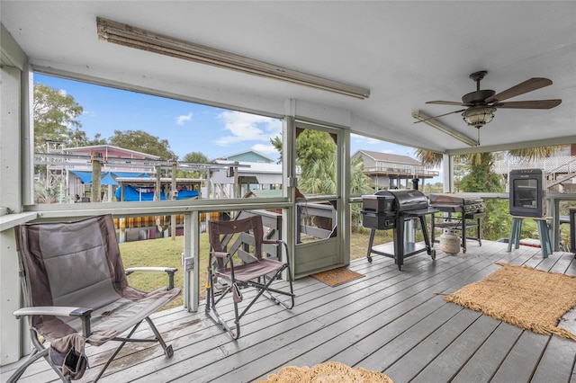 sunroom / solarium with ceiling fan