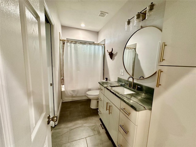 full bathroom featuring vanity, shower / bath combo, toilet, and tile patterned floors