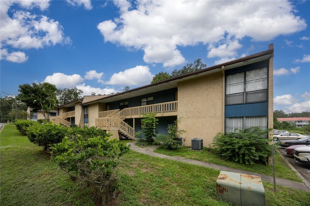 view of property featuring central AC unit