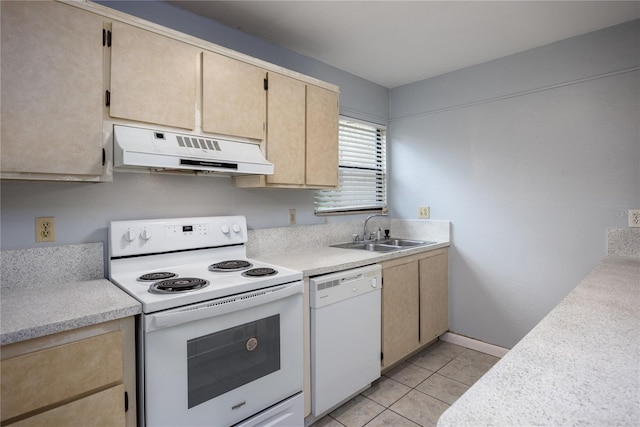 kitchen featuring light tile patterned floors, white appliances, light brown cabinets, and sink