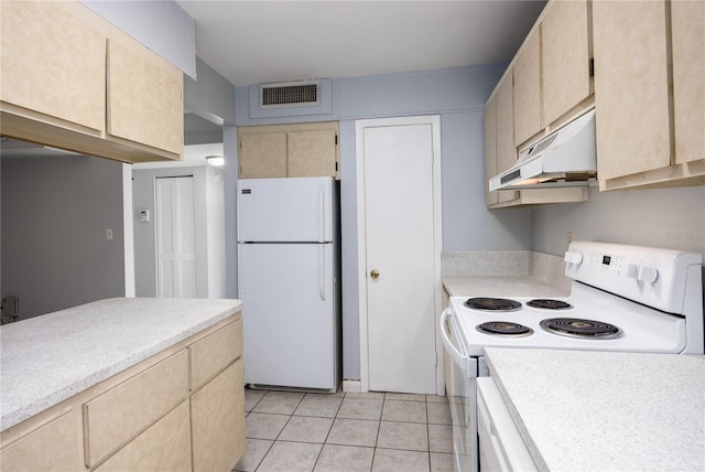 kitchen featuring white appliances, light brown cabinets, visible vents, and under cabinet range hood