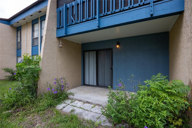 doorway to property featuring a balcony