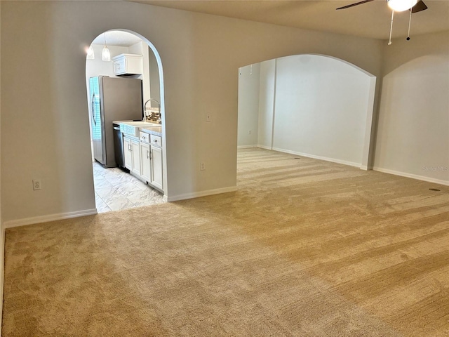 carpeted empty room with ceiling fan