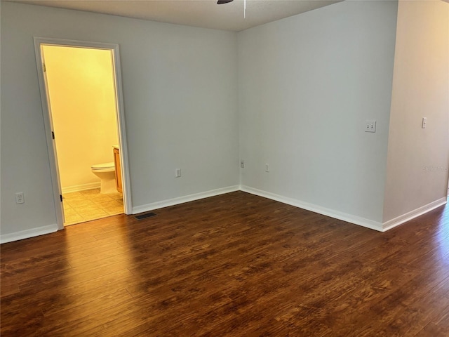 empty room featuring ceiling fan and wood-type flooring