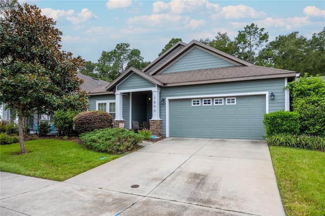 view of front facade featuring a front lawn and a garage