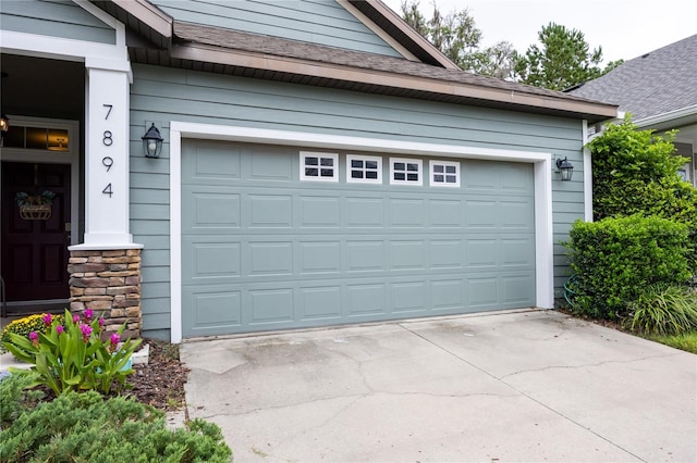 garage featuring wooden walls