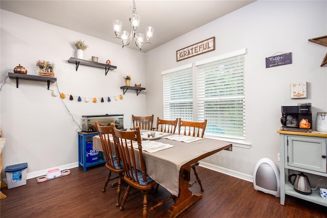 dining area with an inviting chandelier and dark hardwood / wood-style floors