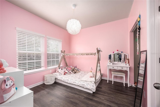 bedroom with dark wood-type flooring