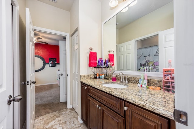 bathroom featuring ceiling fan and vanity