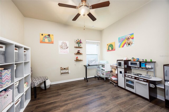 miscellaneous room featuring ceiling fan and dark hardwood / wood-style flooring