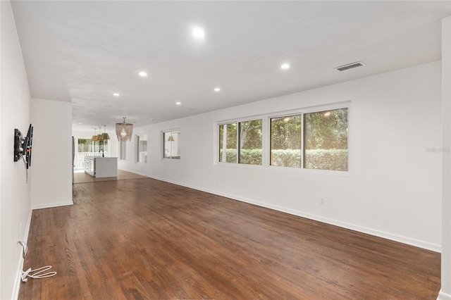 empty room featuring dark wood-type flooring