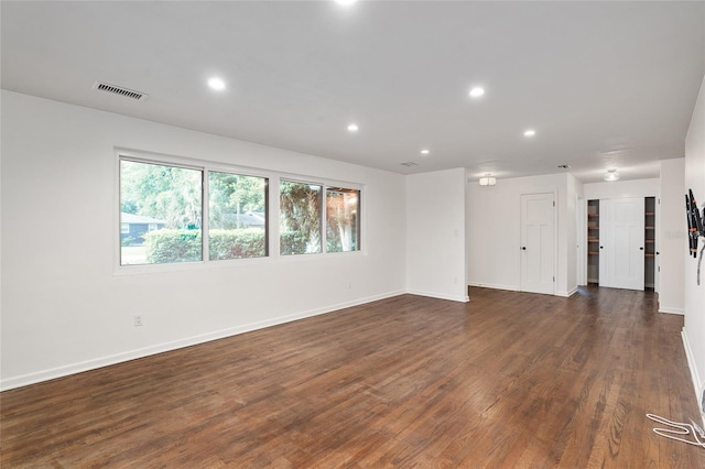 spare room with dark hardwood / wood-style flooring