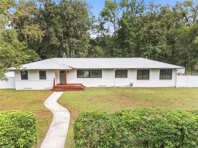 ranch-style home with a front yard