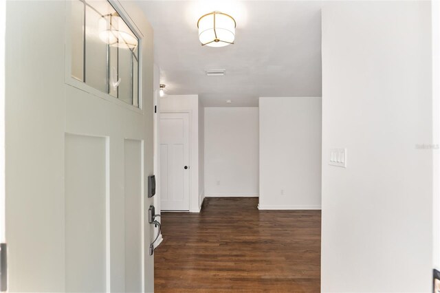 foyer with dark wood-type flooring