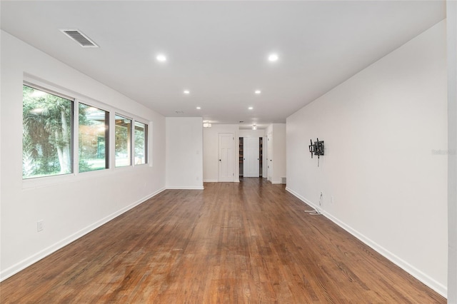 empty room with dark hardwood / wood-style floors