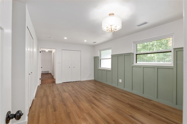 unfurnished bedroom featuring light hardwood / wood-style floors