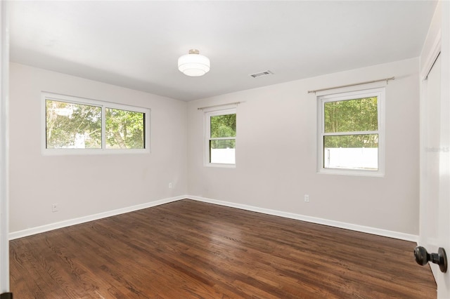 empty room featuring dark hardwood / wood-style floors