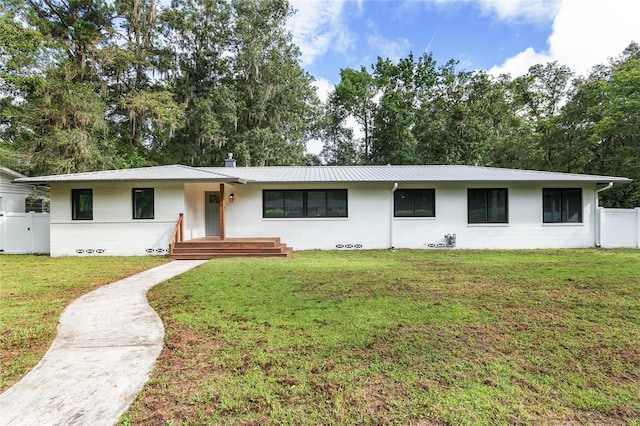 ranch-style home with a front lawn