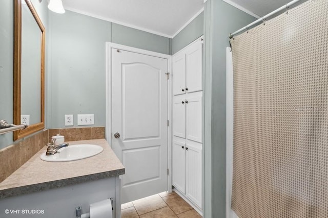 bathroom featuring ornamental molding, curtained shower, tile patterned floors, and vanity