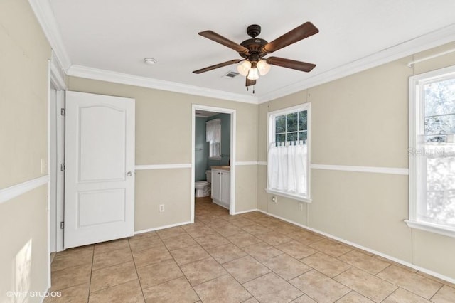 unfurnished bedroom with ceiling fan, crown molding, ensuite bath, and light tile patterned flooring