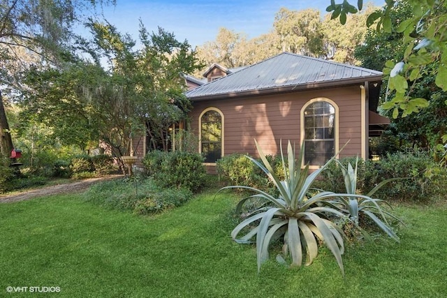 view of home's exterior with a yard