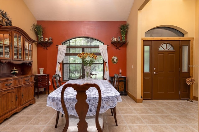 dining space with vaulted ceiling