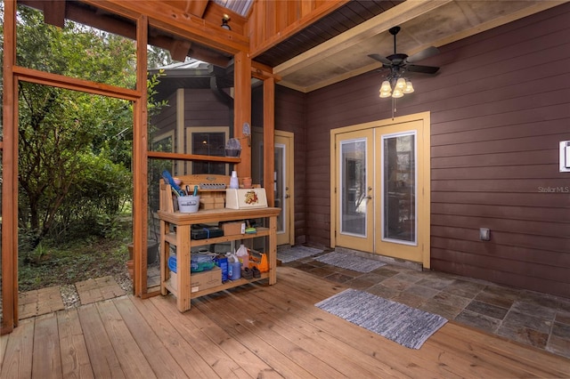 wooden deck featuring ceiling fan