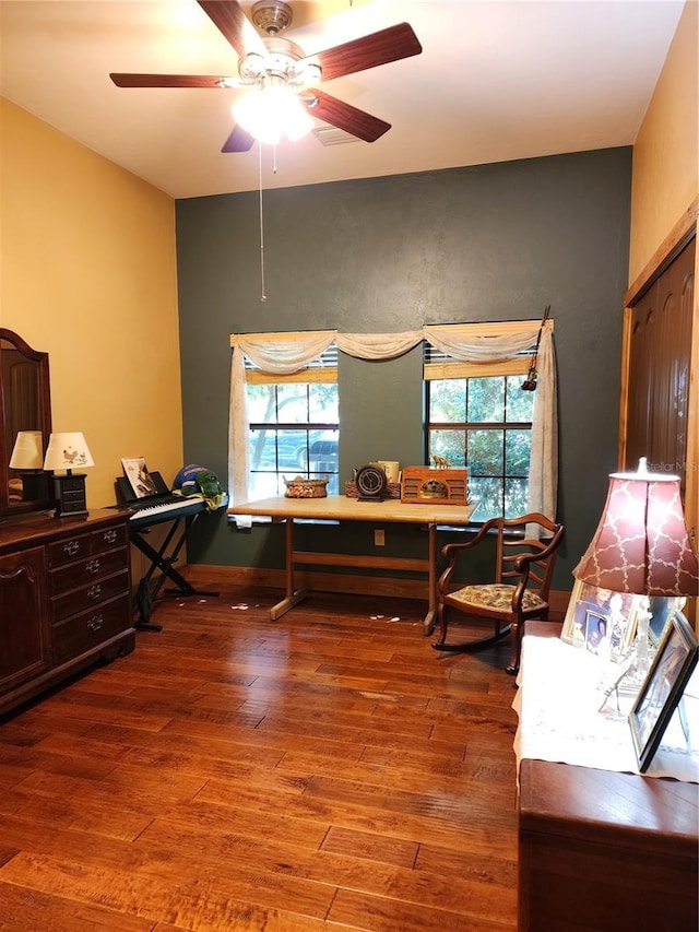 home office with hardwood / wood-style flooring and ceiling fan