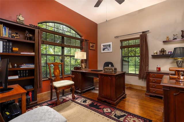 office space featuring ceiling fan and dark hardwood / wood-style flooring