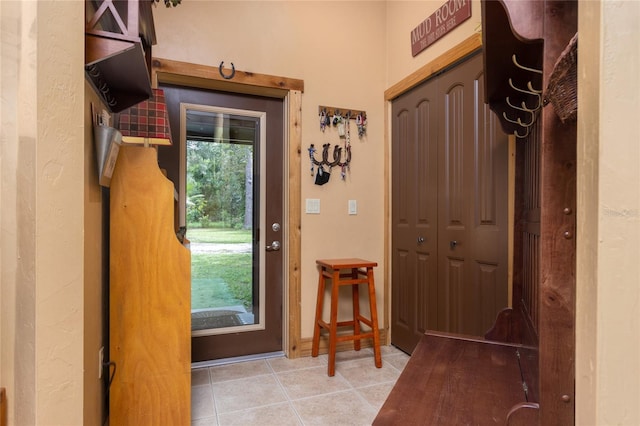 entryway with light tile patterned floors