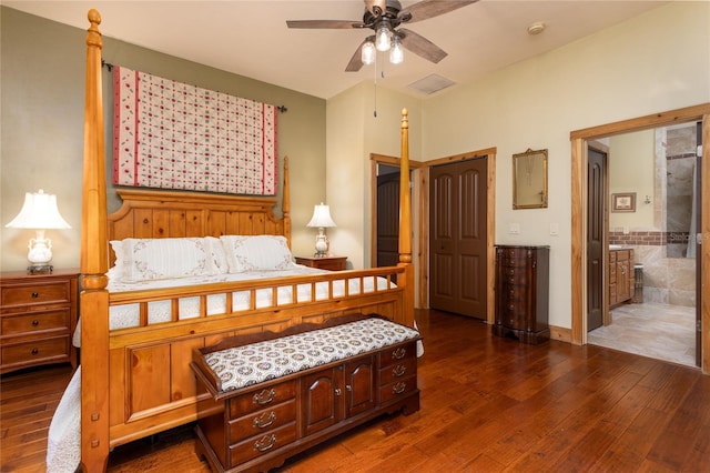 bedroom with dark wood-type flooring and ensuite bath