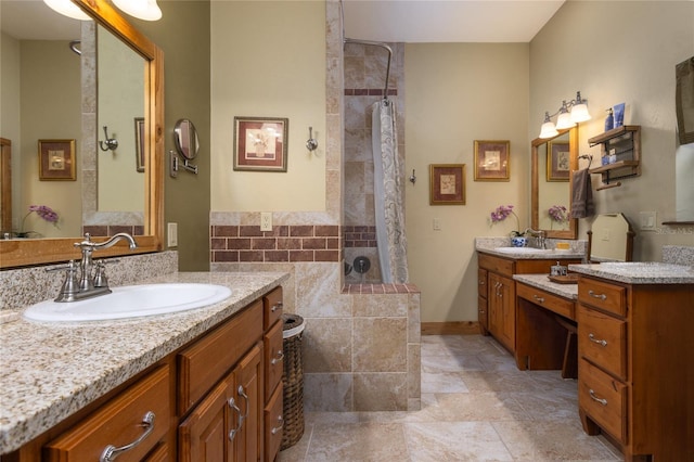 bathroom featuring vanity and tiled shower