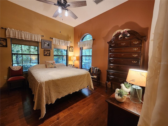 bedroom featuring ceiling fan and dark hardwood / wood-style flooring