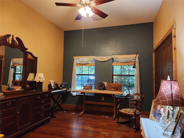 interior space featuring ceiling fan and dark hardwood / wood-style flooring