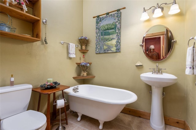 bathroom featuring tile patterned flooring, a bathtub, and toilet