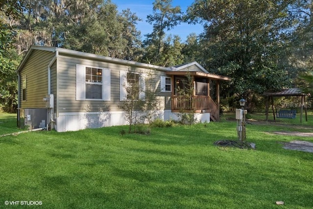 view of front of home featuring a gazebo and a front yard