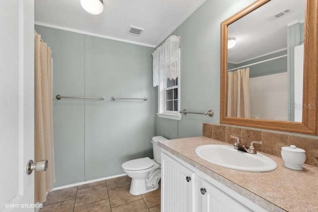 bathroom featuring tile patterned flooring, vanity, backsplash, and toilet