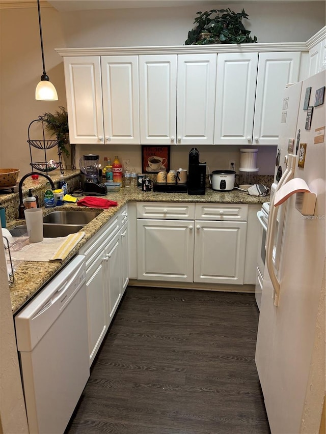 kitchen featuring white appliances, dark hardwood / wood-style flooring, pendant lighting, and white cabinets