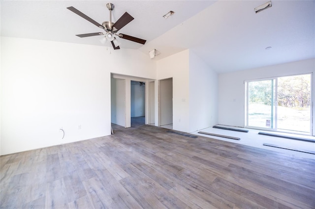 spare room featuring lofted ceiling, hardwood / wood-style flooring, and ceiling fan