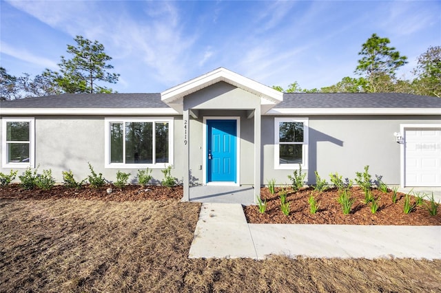 ranch-style home with a garage