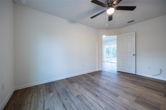 unfurnished room with ceiling fan and light wood-type flooring