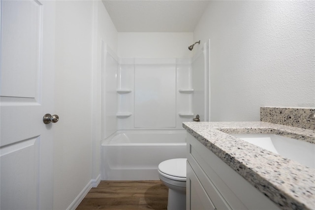 full bathroom featuring vanity, wood-type flooring,  shower combination, and toilet