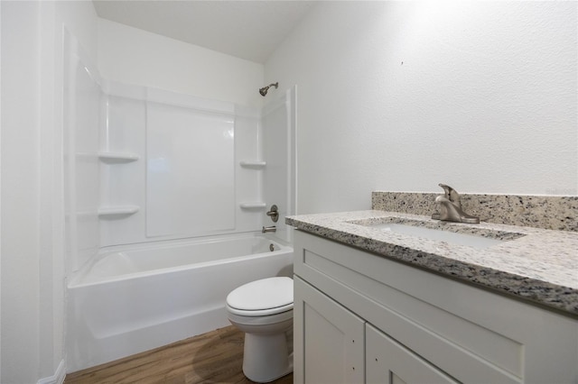 full bathroom featuring wood-type flooring, shower / washtub combination, vanity, and toilet