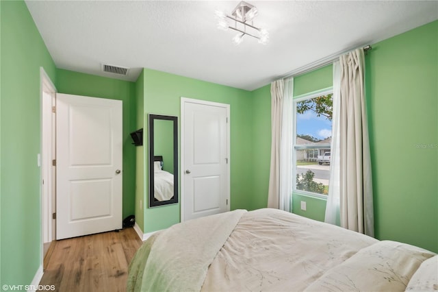 bedroom featuring light hardwood / wood-style flooring