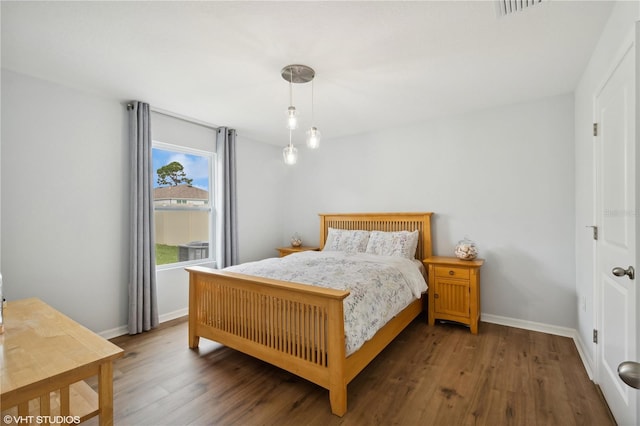 bedroom featuring dark wood-type flooring