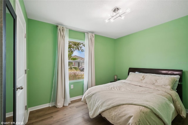 bedroom with wood-type flooring