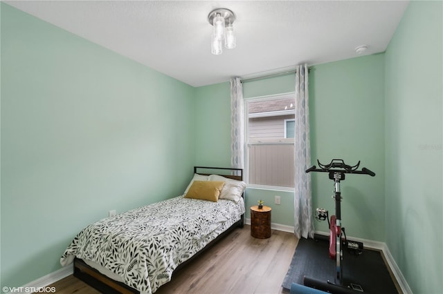 bedroom with hardwood / wood-style flooring