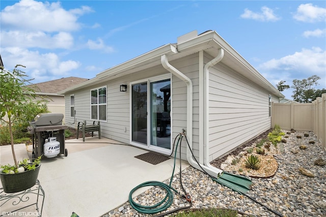 rear view of property featuring a patio area